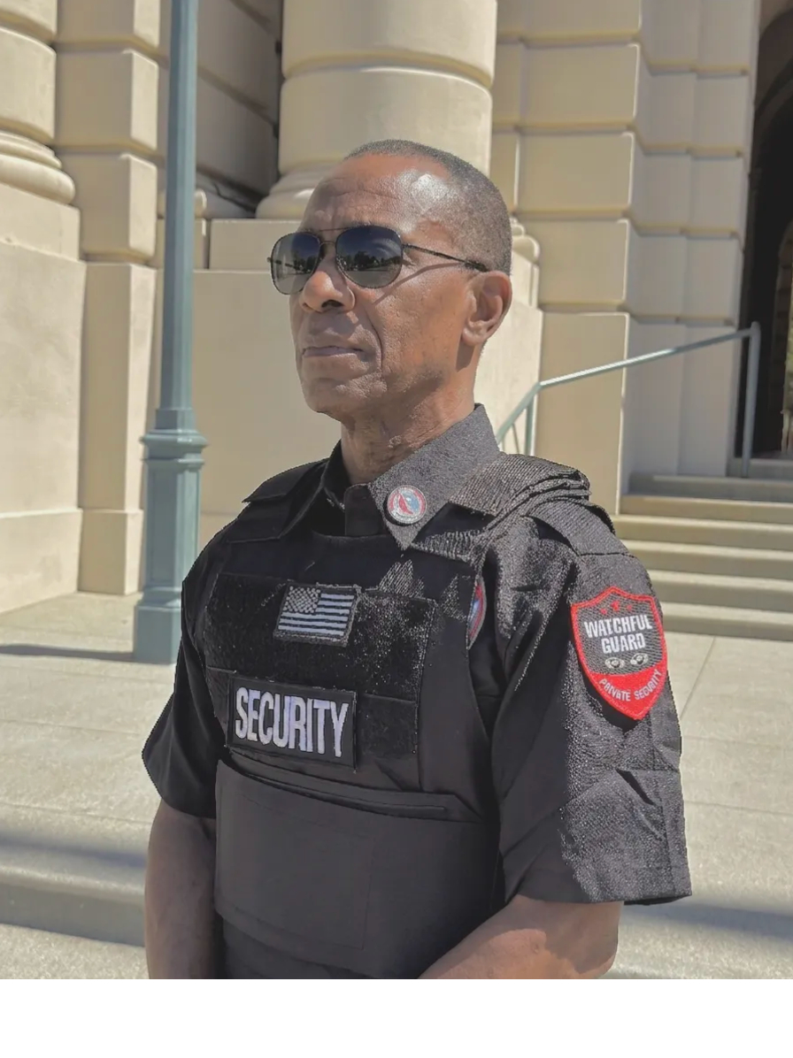 BSIS licensed K9 security handler-and-canine team patrolling an industrial property perimeter